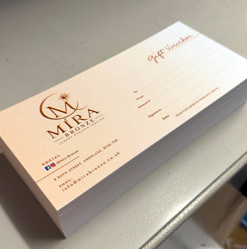 Stack of DL gift vouchers printed for a local beauty business by Plus2Print, Downpatrick