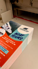 Stack of printed leaflets ready for collection in Downpatrick